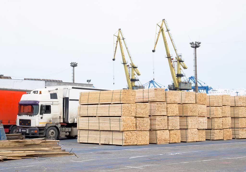 Pile Of Logs At The Port Ready For Loading To Ships